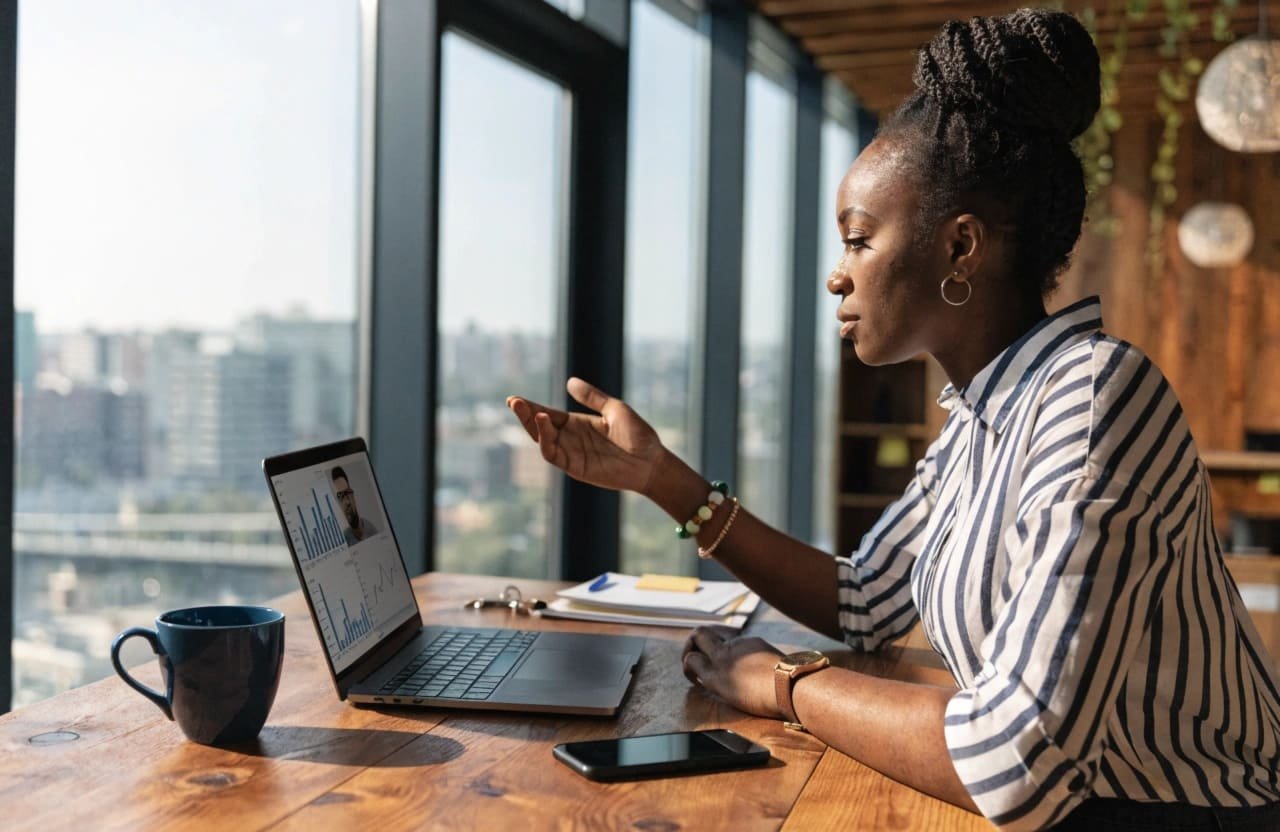 A procurement manager on a video call with a supplier, discussing technical specifications